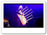 Bill Bailey playing his 6 neck guitar